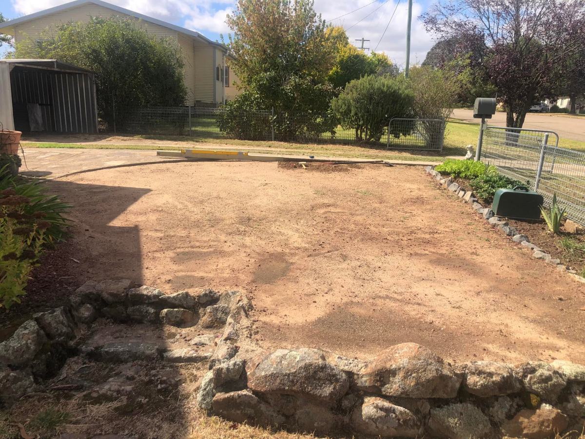 Area cleared to compacted earth with tidied and reset stone edging