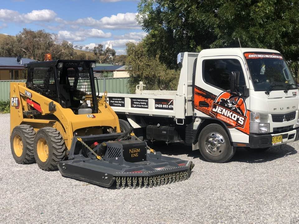 Jenko's skid steer with slasher attachment